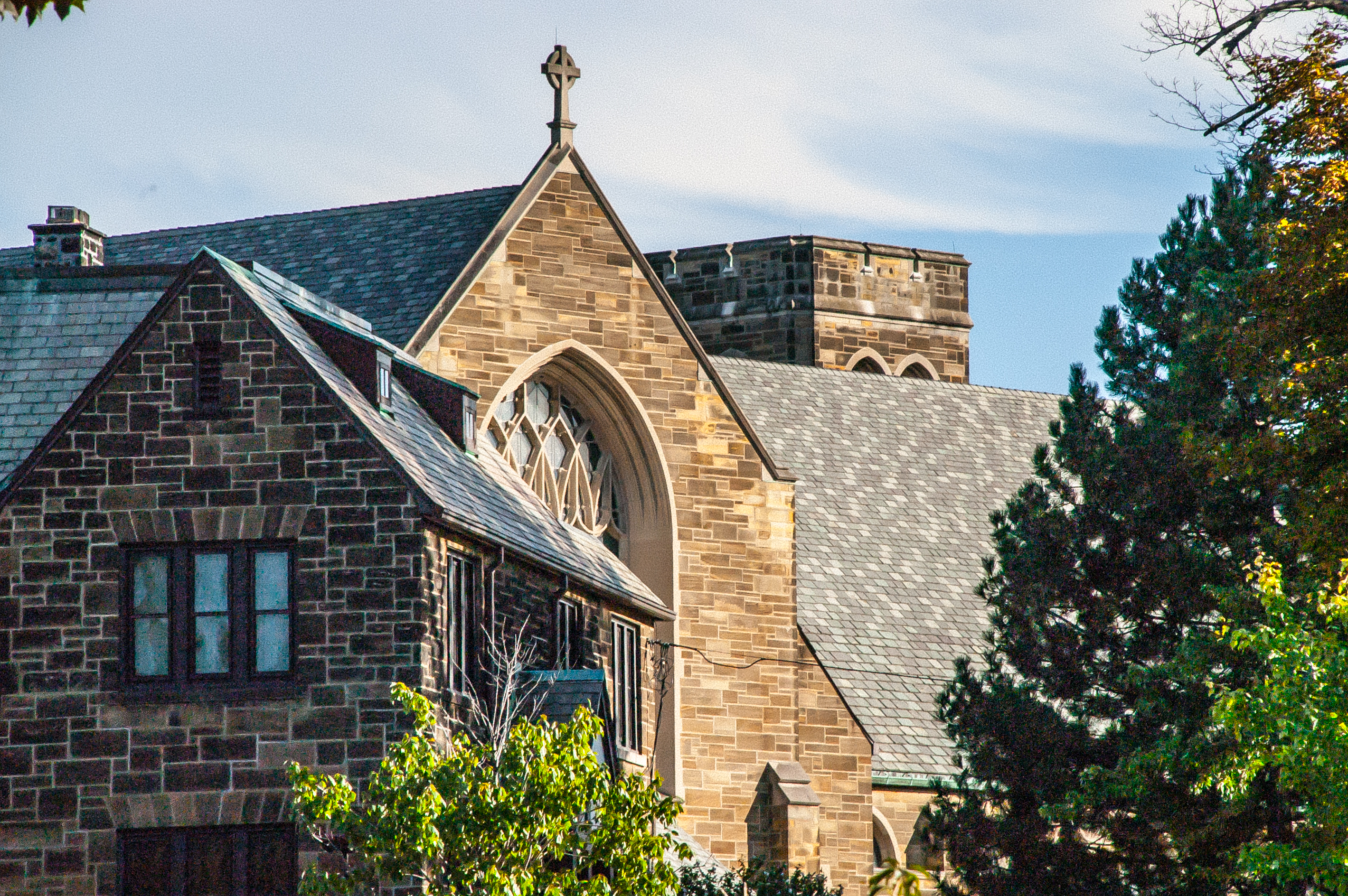 Rooftop and cross view of St. Benedict Roman Catholic Church building 14226